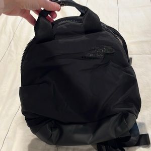 North face never stop mini backpack